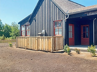 ranch style house with fence