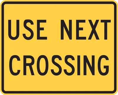 W10-14AP Use Next Crossing (plaque)