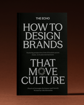 A book is standing in a studio setting in front of brown background. Book cover is facing the camera.