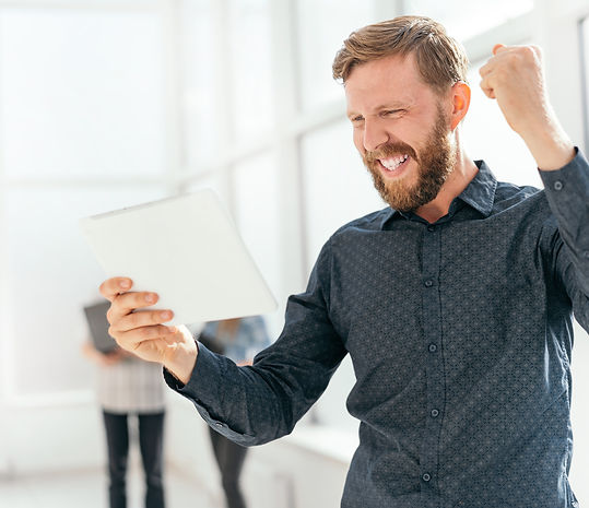 happy-man-getting-good-news-his-email_edited.jpg