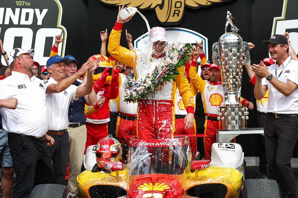 Josef Newgarden celebrates a typical Indy 500 tradition; Credit - Chris Owens