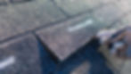 Home inspector examining an asphalt shingle roof during a Cedrus Property Inspections home inspection.
