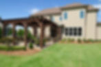 A large house with Landscape Design & Consultation