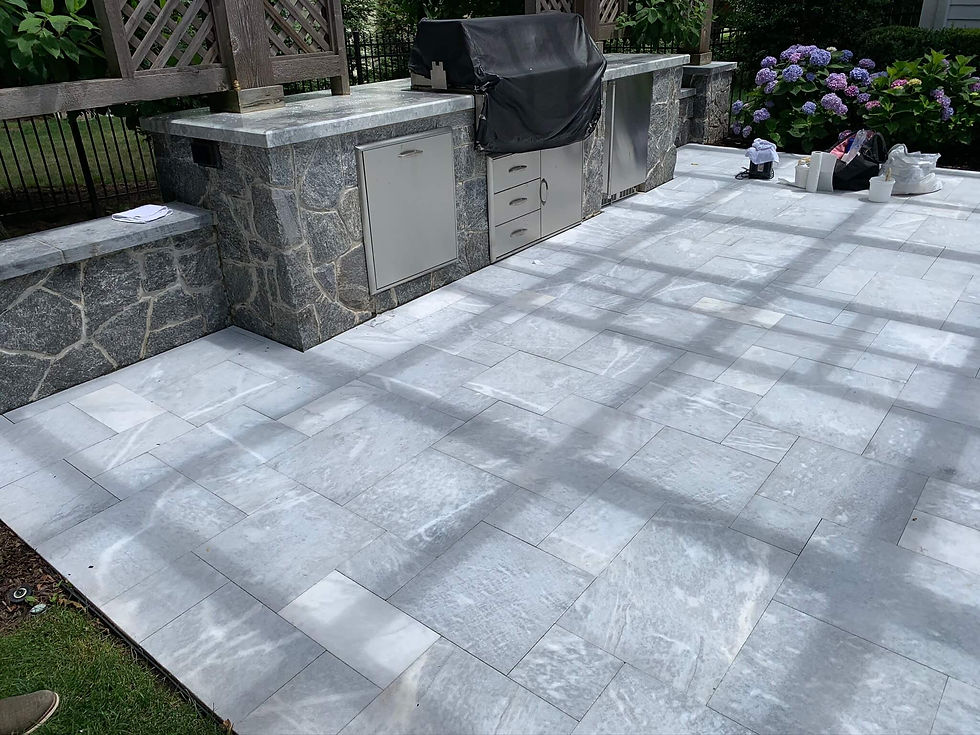 Eye-level view of natural stone patio with protective sealant applied