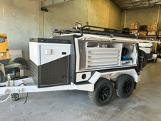 Hydraulic hose repair trailer with secure compartments and bunded tanks