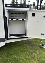 Heavy-duty RedDirt Tradesman Trailer with secure storage, off-road tyres, and ladder racks