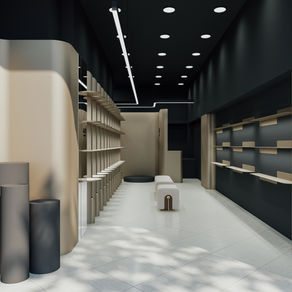 Sola Boutique retail interior designed by Armin Raad, showcasing modern shelving, curved beige walls, and ambient lighting in a minimalist space.