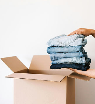 packing clothes in a box