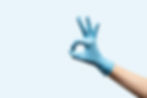 female-hand-disposable-gloves-light-blue-background_edited.jpg