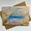 Thumbnail: Original handmade blank art card featuring and abstract landscape of yellows, blues, green, and gold.