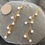 Thumbnail: dancing pearls long earrings