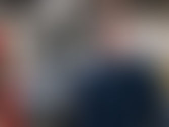 Man in front of a machine with safety glasses on