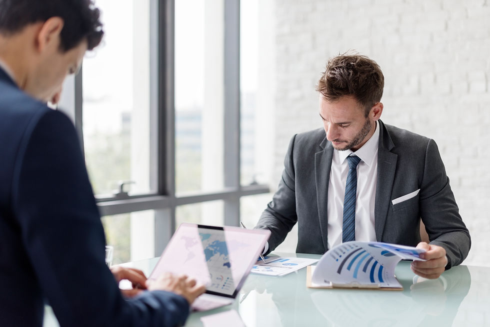 cropped-view-businesswomen-reading-document