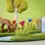 Thumbnail: Bumbu Toys Wooden Grass With Pink Flower Small. Handcrafted Waldorf inspired toys. Imaginative play and storytelling