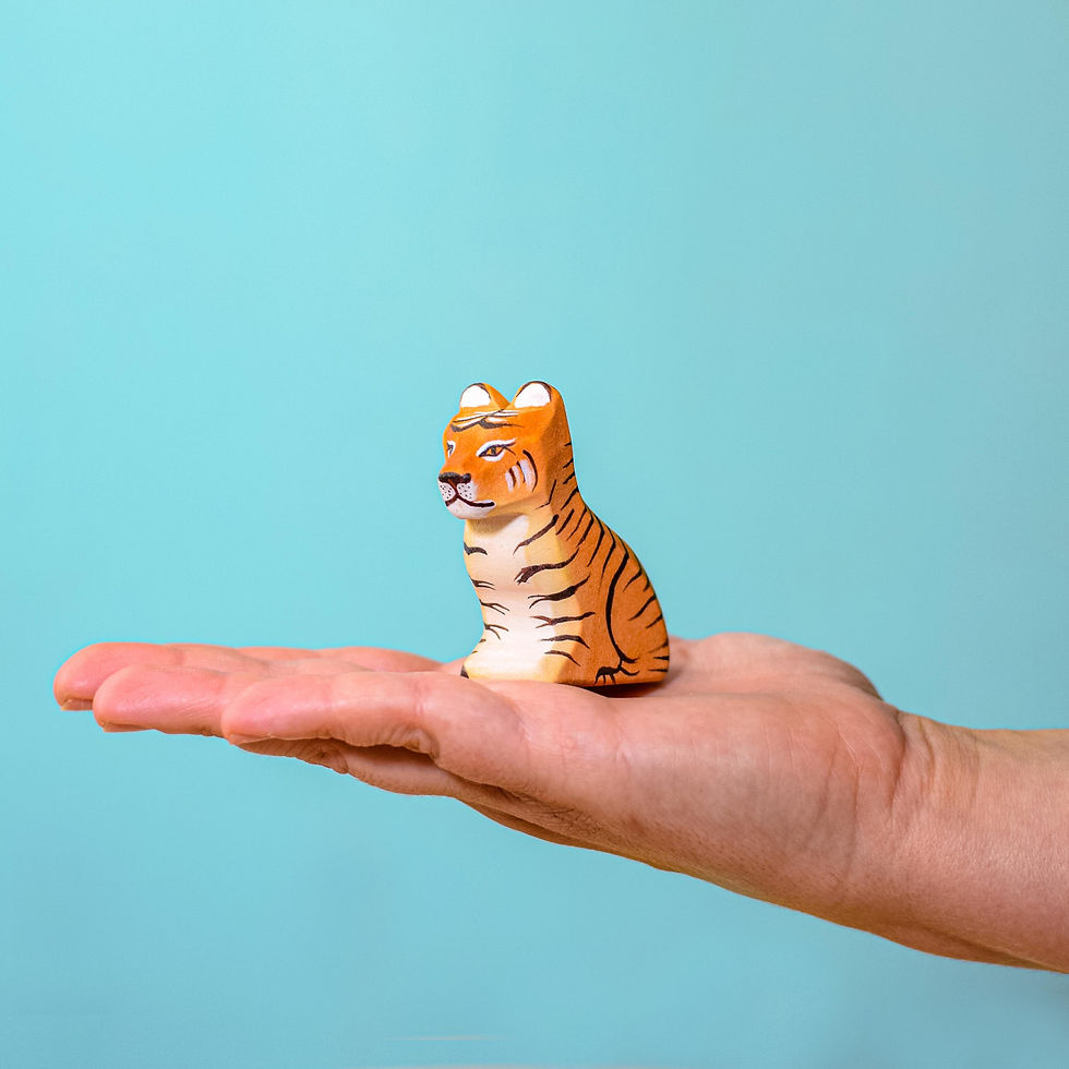 Thumbnail: Bumbu Toys Wooden Tiger Cub Sitting in Hand. Handcrafted Waldorf inspired toys. Imaginative play and storytelling