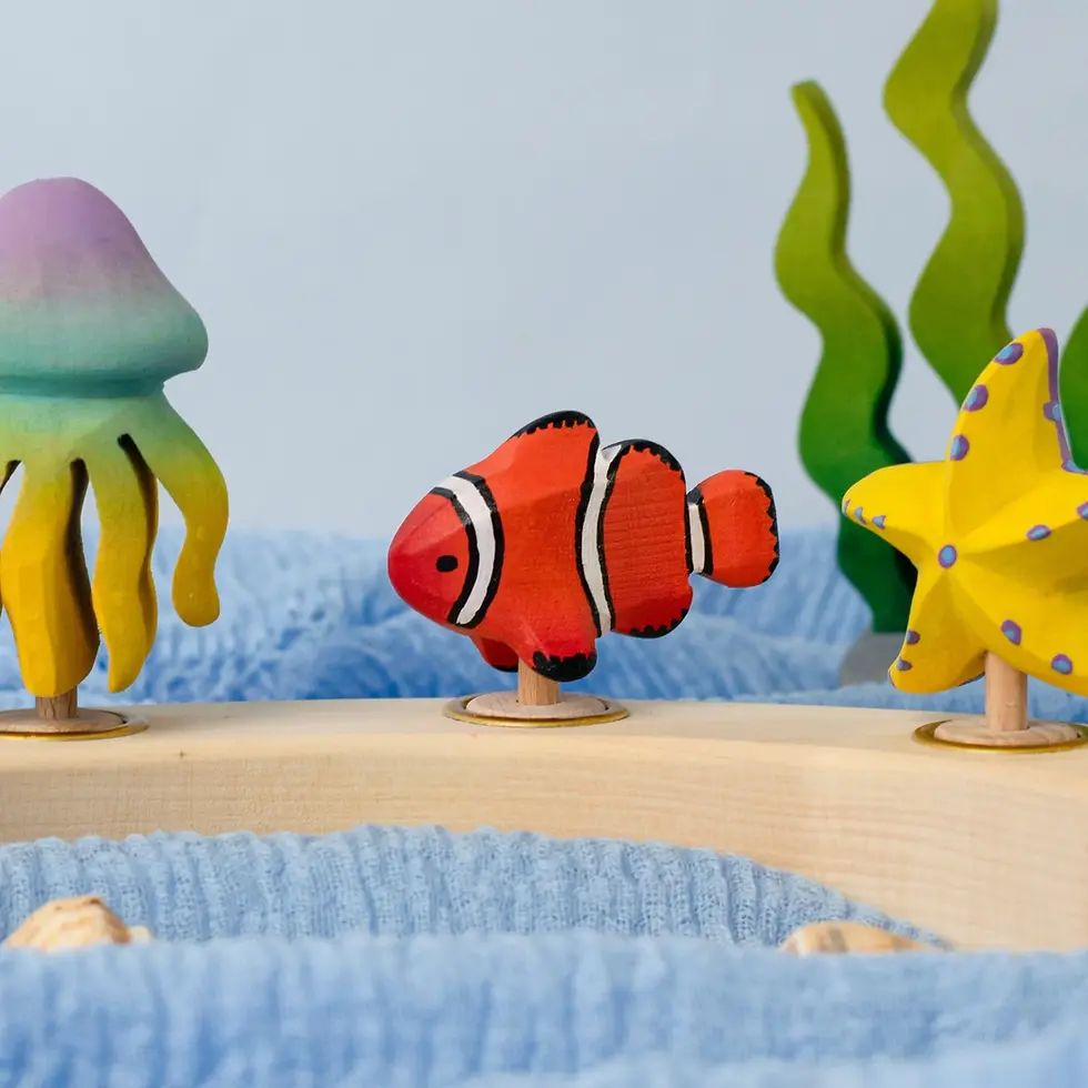 Thumbnail: Bumbu Toys Clownfish Celebration Ring Figure. Handcrafted Waldorf small world toys and seasonal nature displays.