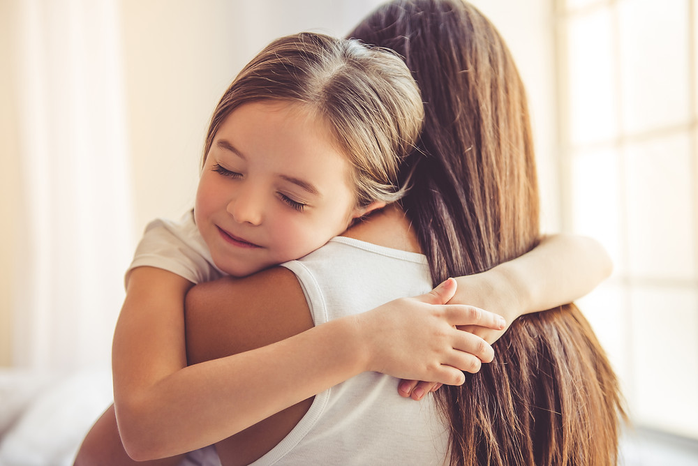 Girl hugging her mother