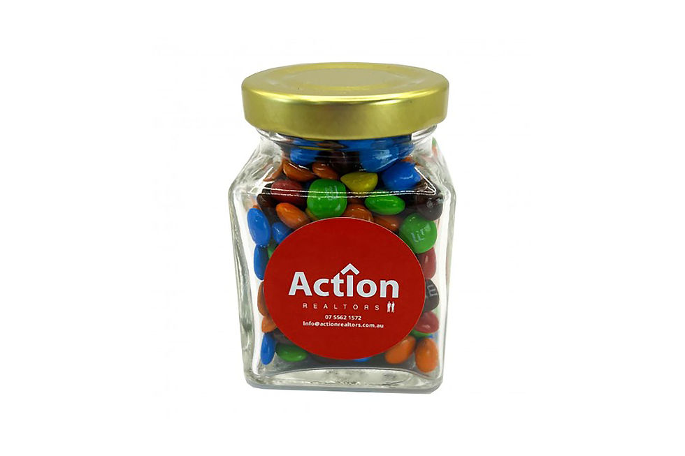 Custom branded small square glass jar with mini chocolate candies, colourful promotional product for corporate giveaways