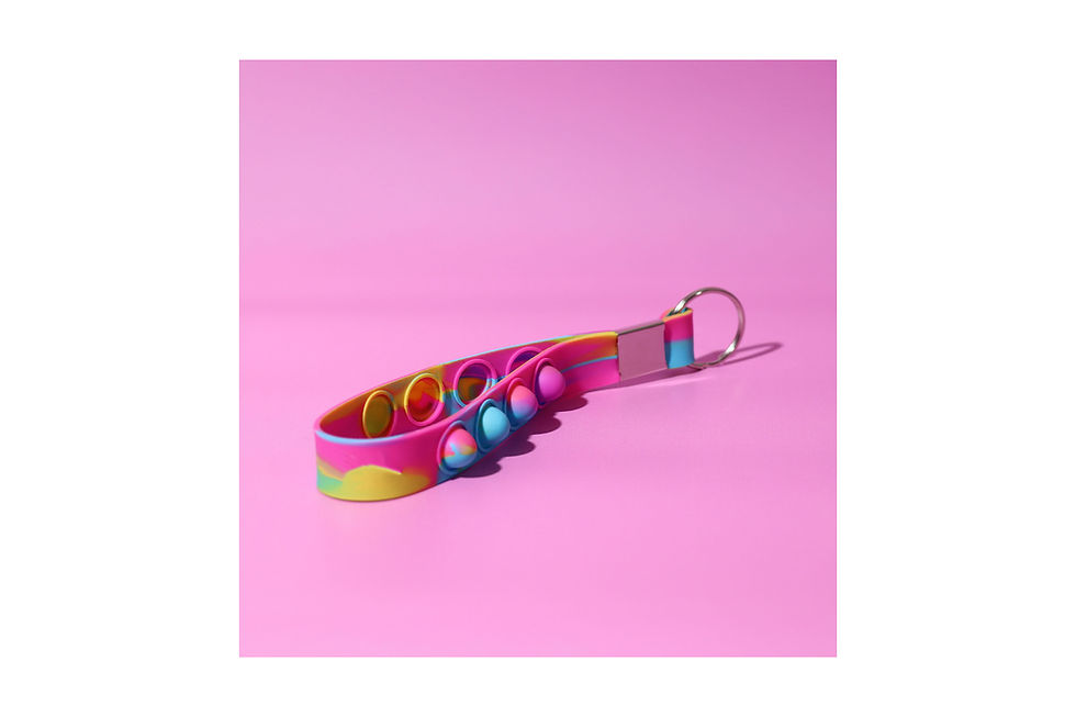 Personalised popper strap keyrings combining stress-relieving play with practical key organisation and custom branding