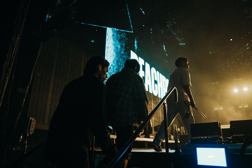 “PeachPuffs performing as the opening band for Linkin Park on the From Zero World Tour at Etihad Arena, with Mike Shinoda, sold-out concert crowd, live rock and indie show, Victoria Dorei as tour manager handling tour management, artist support, concert logistics, music tour coordination, backstage access, and festival tour management.”