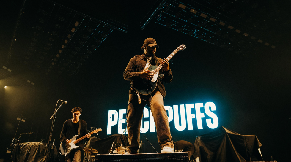 “PeachPuffs performing as the opening band for Linkin Park on the From Zero World Tour at Etihad Arena, with Mike Shinoda, sold-out concert crowd, live rock and indie show, Victoria Dorei as tour manager handling tour management, artist support, concert logistics, music tour coordination, backstage access, and festival tour management.”