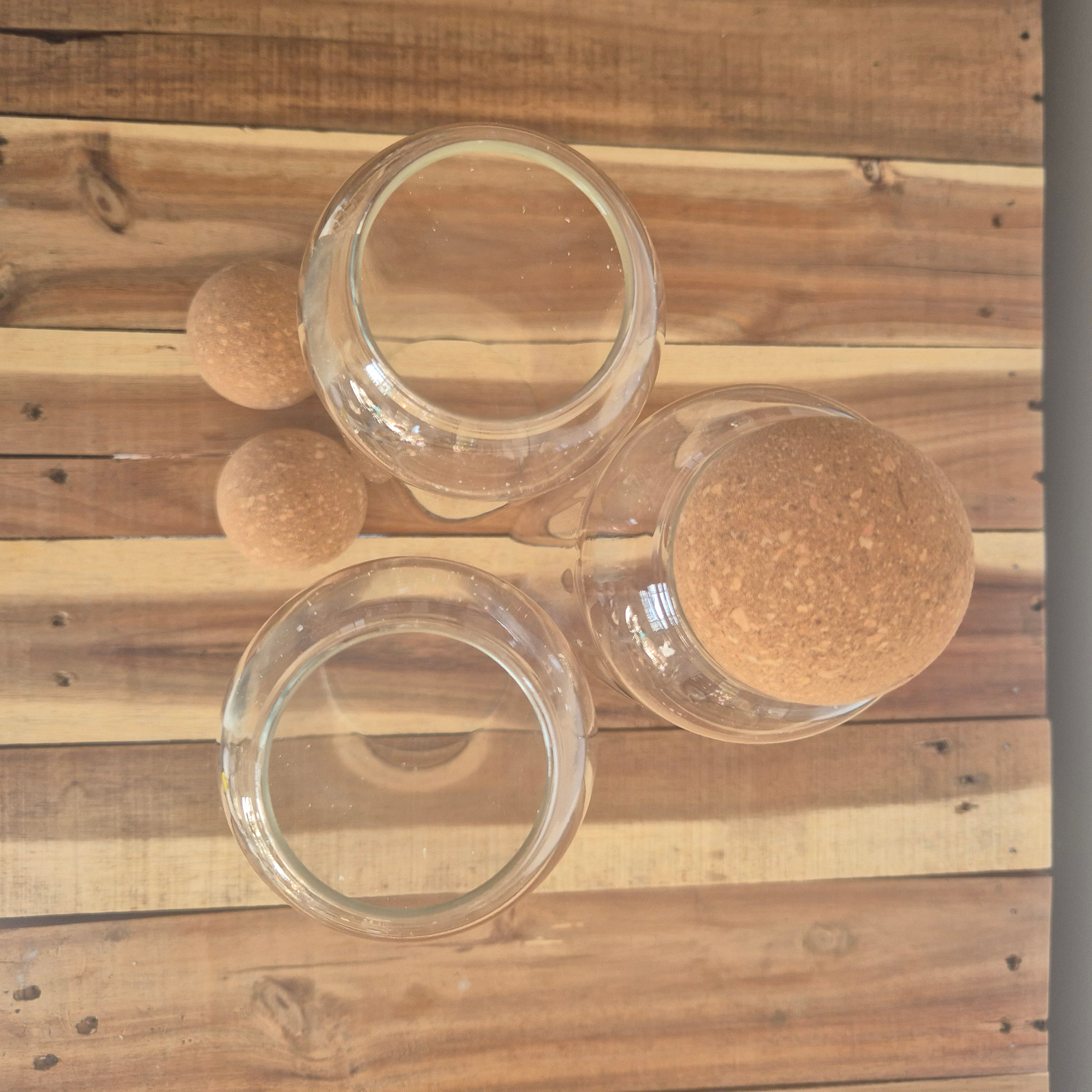 Tall glass jars with wooden cork sypherical lids