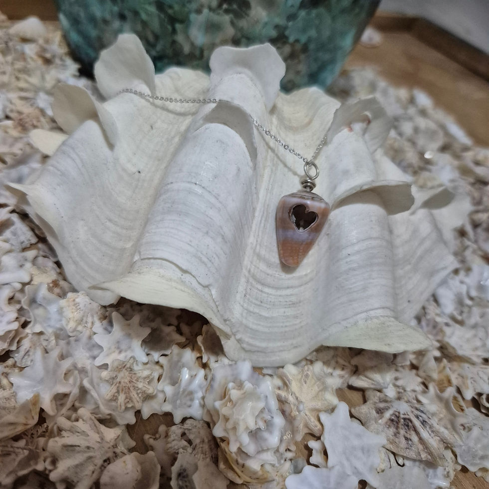 Thumbnail: Sterling silver cone cone shell necklace with hand cut heart