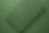 Intricate design on a green surface featuring geometric patterns and floral motifs. The background matches the design color. No text visible.