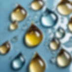drops of beauty oils on a light blue palette.jpg