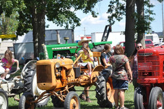 girl on antique tractor.jpeg