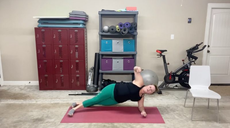 Gretchen Gegg does a demonstration of a side plank.