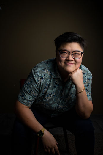 Professional corporate headshot of woman in printed shirt