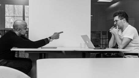 Chairman and CEO arguing, highlighting a bad CEO-chairman relationship.