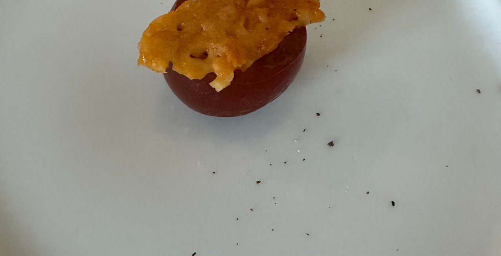 Tomato Consumme Table 5 Tomato Dinner with Black Cherry Tomatoes, Aged Cheddar, and olive oil. Jabri Fine Dining Photo