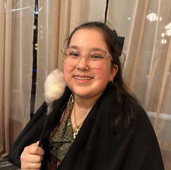 Emma posing with smile in front of curtains. Jabri Fine Dining photo foreigner restaurant in orlando fl.