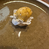 Smyth in Chicago food on decorative plate in flower. 3 Michelin-star experience at Chicago restaurant. Jabri Fine Dining experience and photograph.