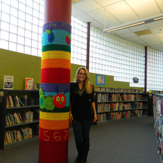 Hungry Little Caterpillar yarn art installation at a public library.