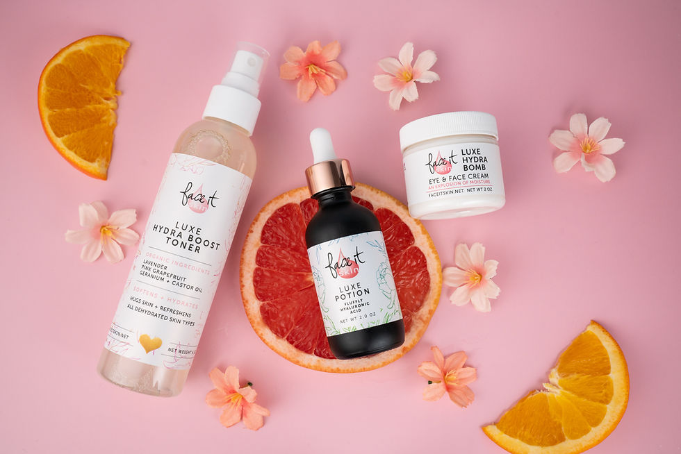 Luxe Hydra Boost Toner displayed with other Face It Skin clean beauty products on a pink background
