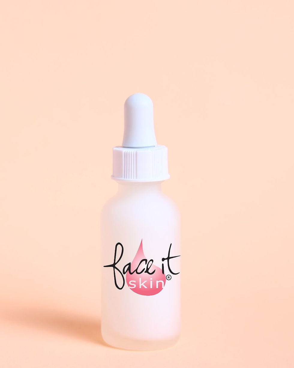 Face It Skin Luxe Serum with a peach background.