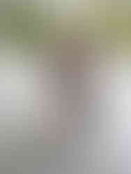 Sandra with her favorite doorman at Raffles