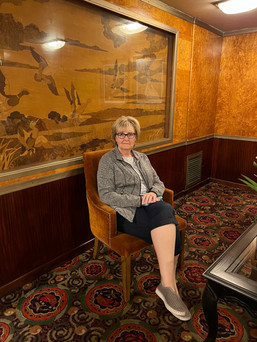 Sandra having a seat, check out the wood panels