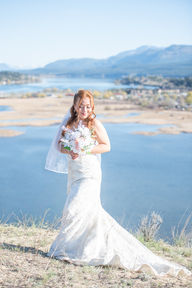 Beautiful bride and bouquet portrait in front of Wilmer Wetlands. Invermere Wedding