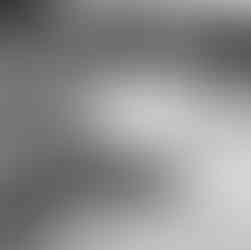 Stunning black and white photo of a woman in a flowing dress with water reflection in Fairmont, BC