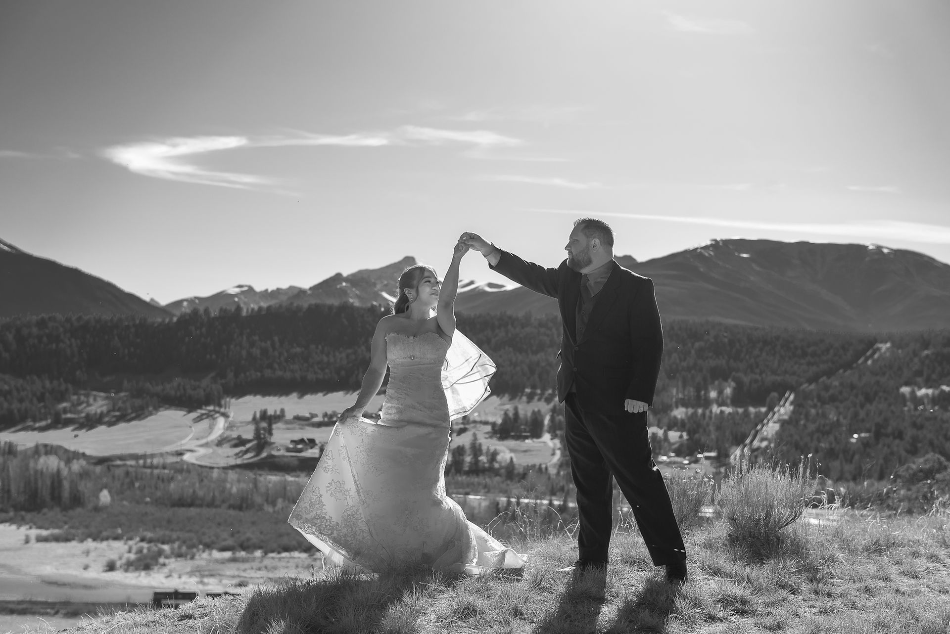Bride and Groom dancing in front of stunning Mountain Backdrop at Eagle Ranch Resort, Invermere