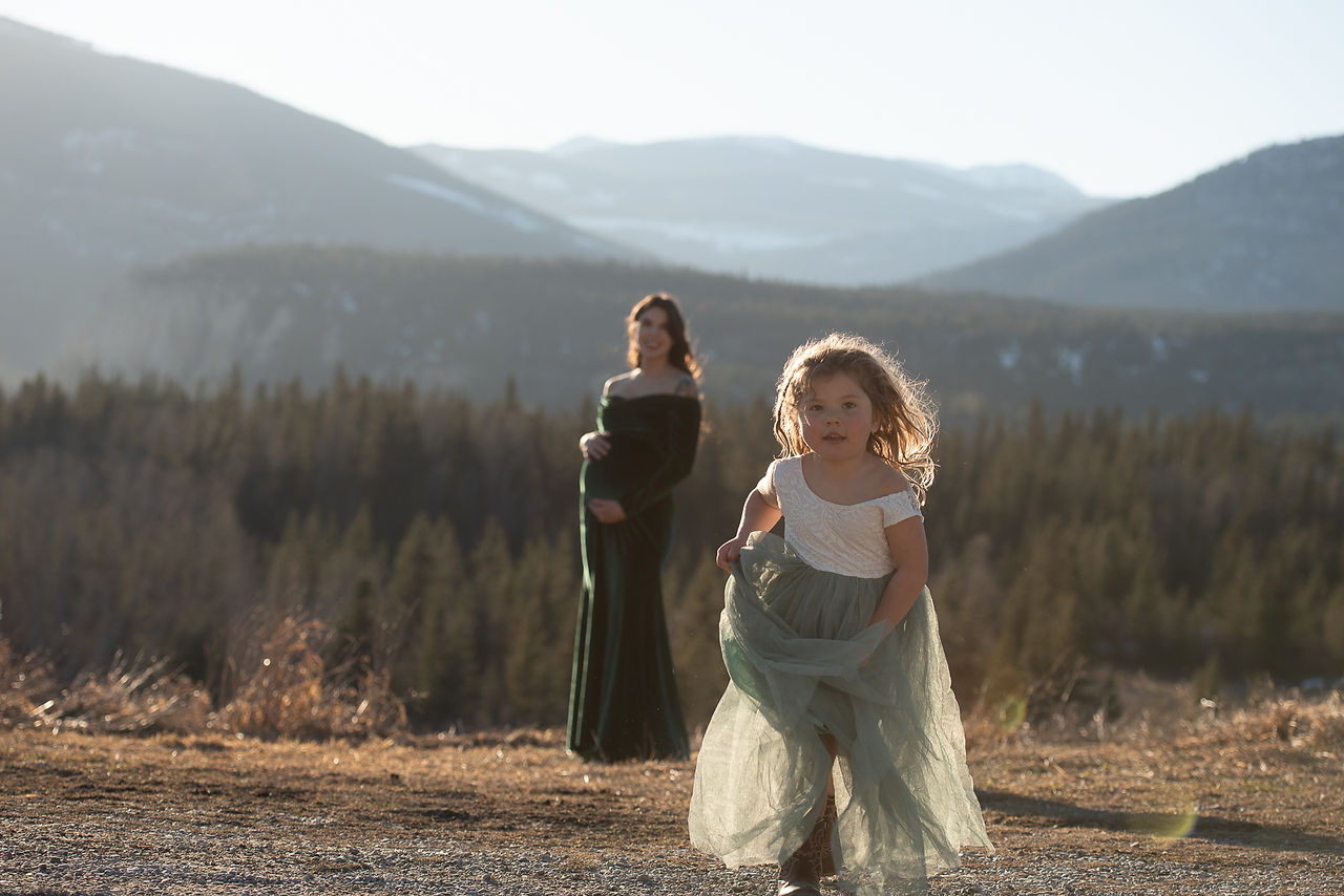 mother an daughter during golden hour in beautiful mountain setting