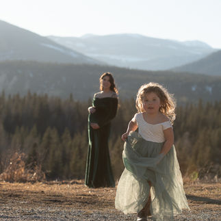 mother an daughter during golden hour in beautiful mountain setting
