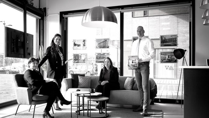 fotograaf legt medewerkers vast op kantoor in Amsterdam