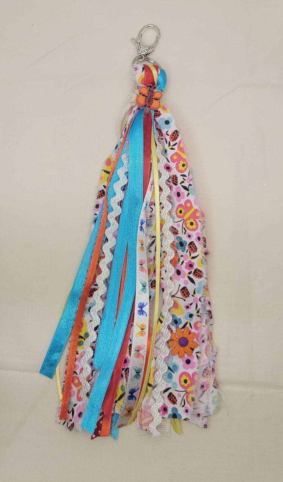 Floral with Orange Butterfly Tassel