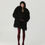 Thumbnail: Full-length front view of Kamianske Black Eco-Coat by WeHeat - black eco-fur winter coat with a straight silhouette