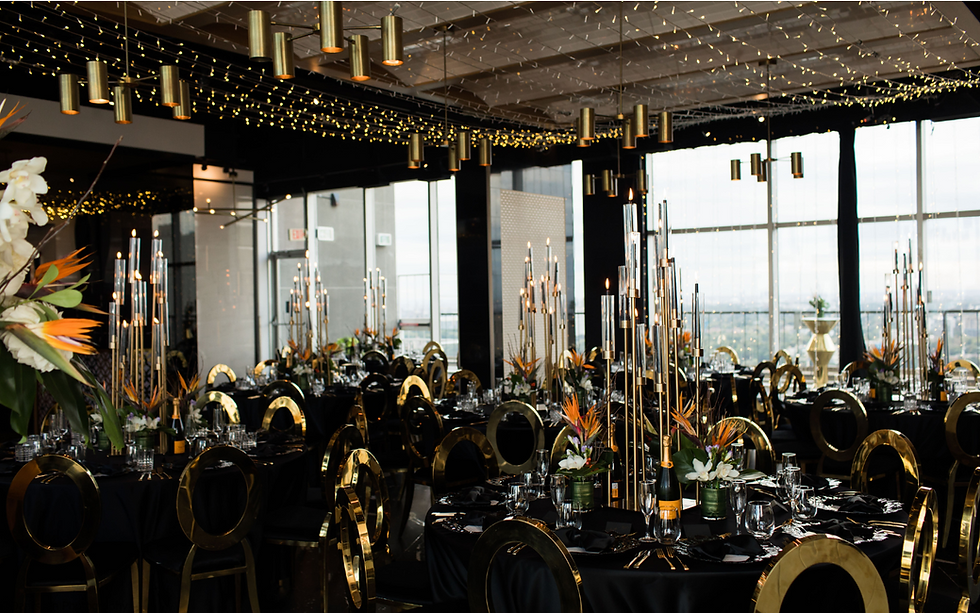 Elegant event setup with floral arrangements and candlelit tables